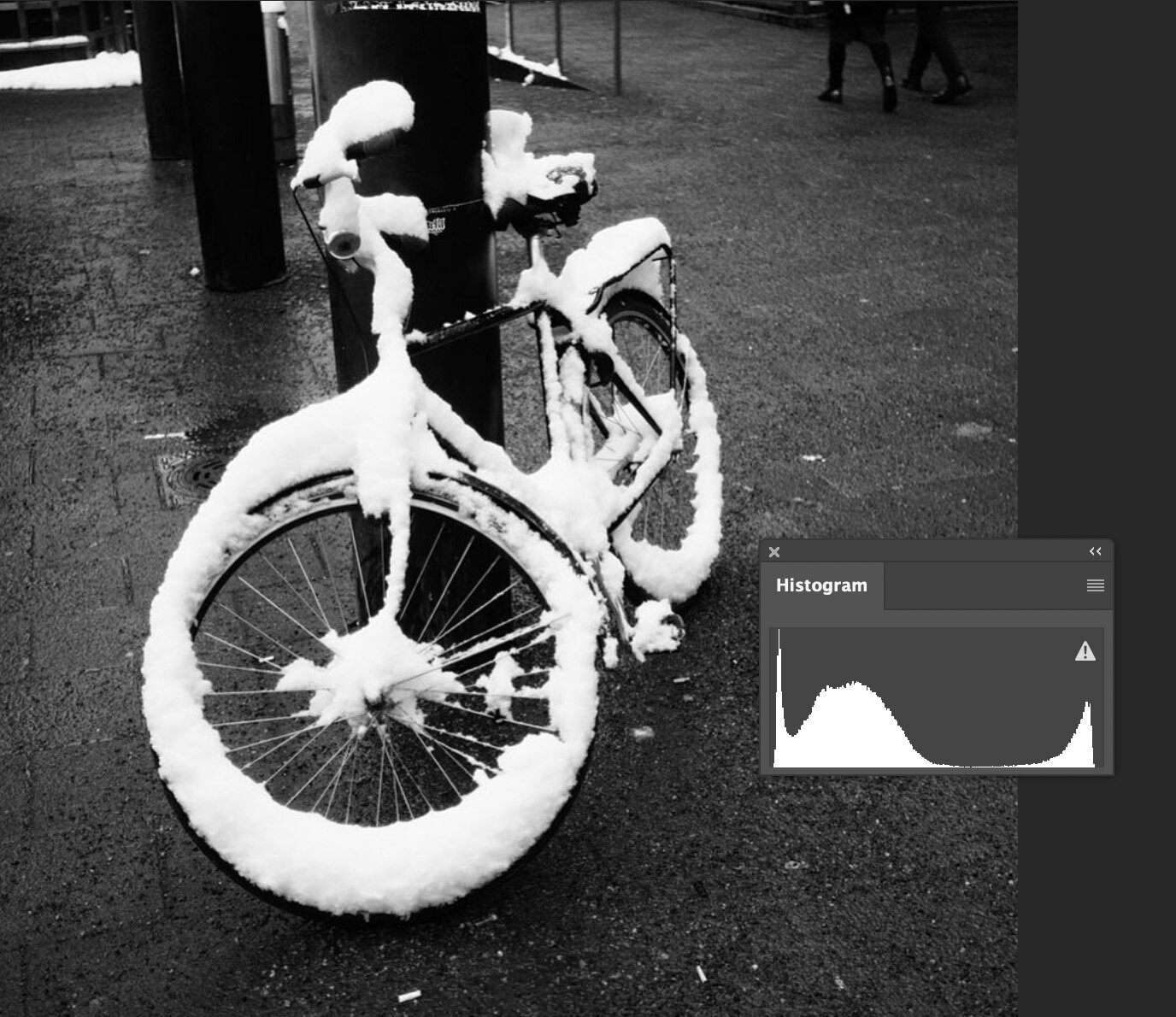This is an example of an image that is ETTR even though the histogram might not look like it. As you see the snow on the bike is not over exposed. The whites pixel is around 254.
