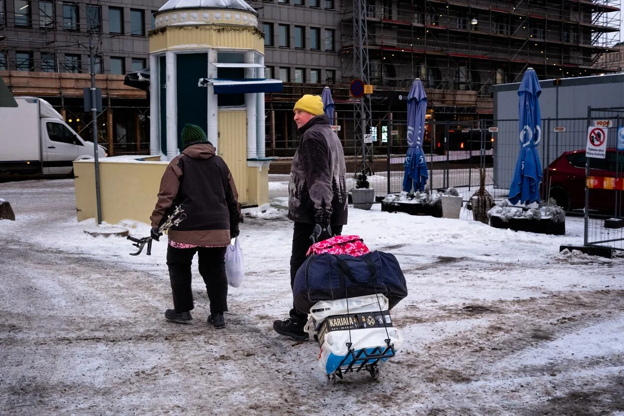 Two people walking on the street