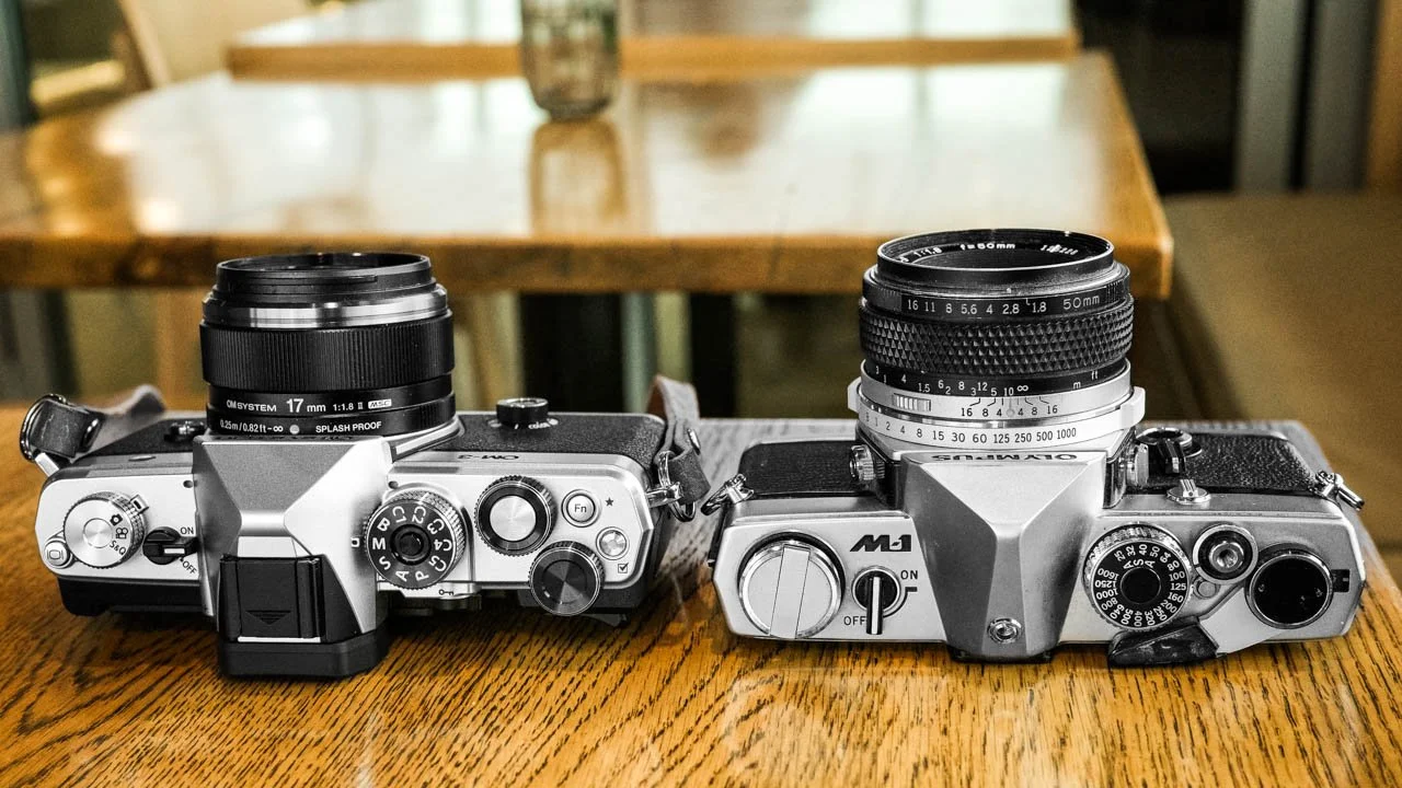 Top view. OM SYSTEM OM-3 on the lewft and Olympus M-1 on the right.
